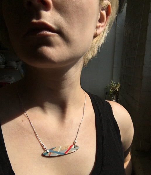 Wearing a Wood Inlay Jewelry Necklace by Laura Jaklitsch Jewelry 